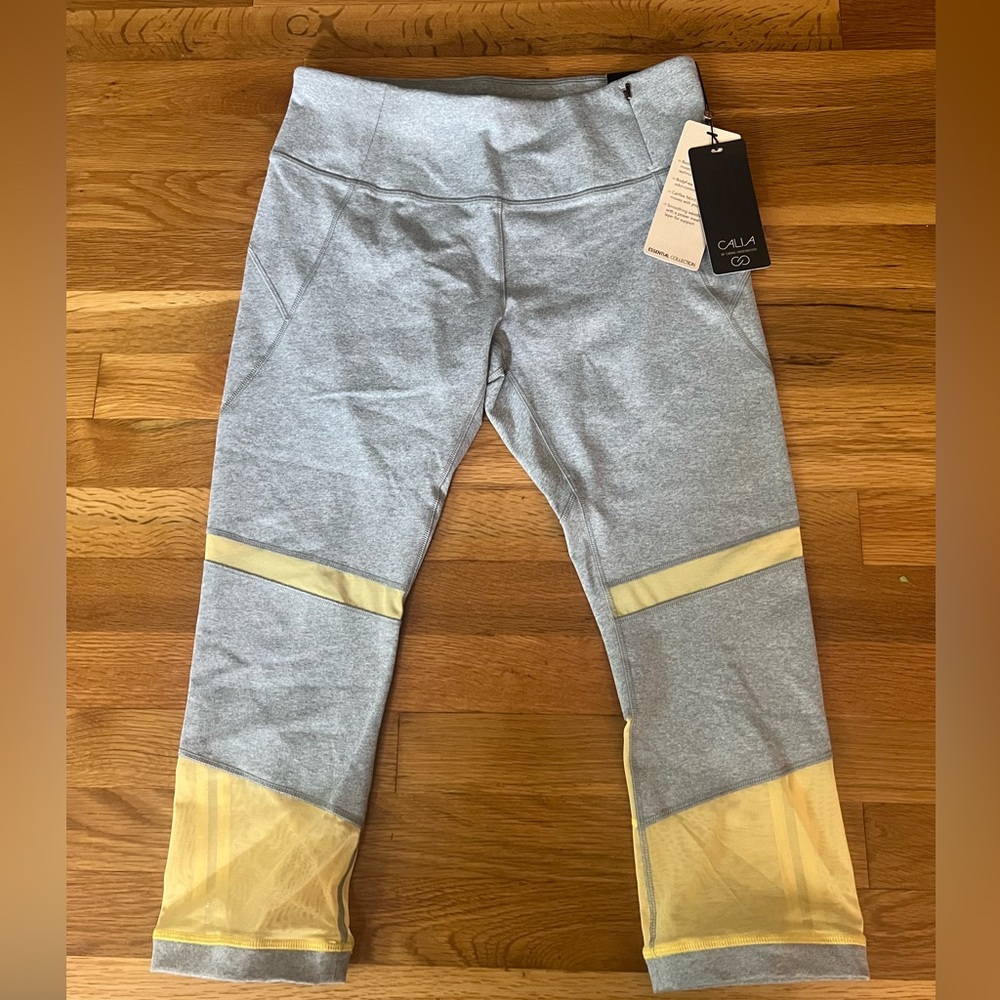 Calia Athletic Capri Leggings with mesh cut outs. Yellow and gray. Size Medium